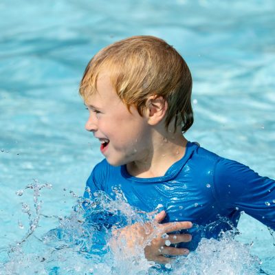 Happy child in the Farm's pool